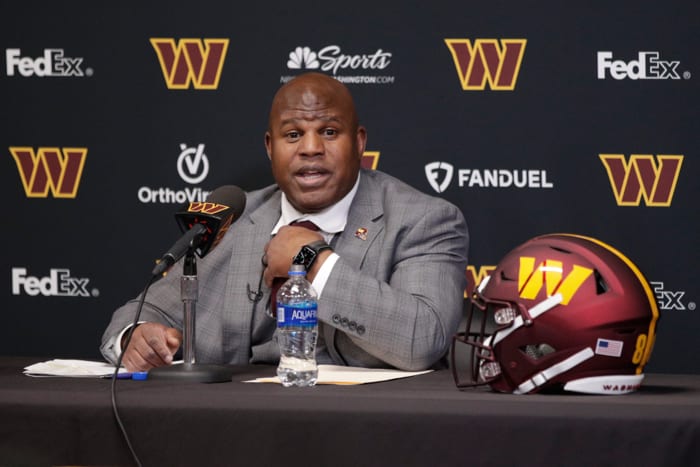 Eric Bieniemy talks to reporters after being introduced as the new offensive coordinator and assistant head coach of the Washington Commanders.